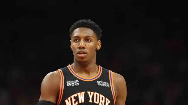 RJ Barrett walking down the court.